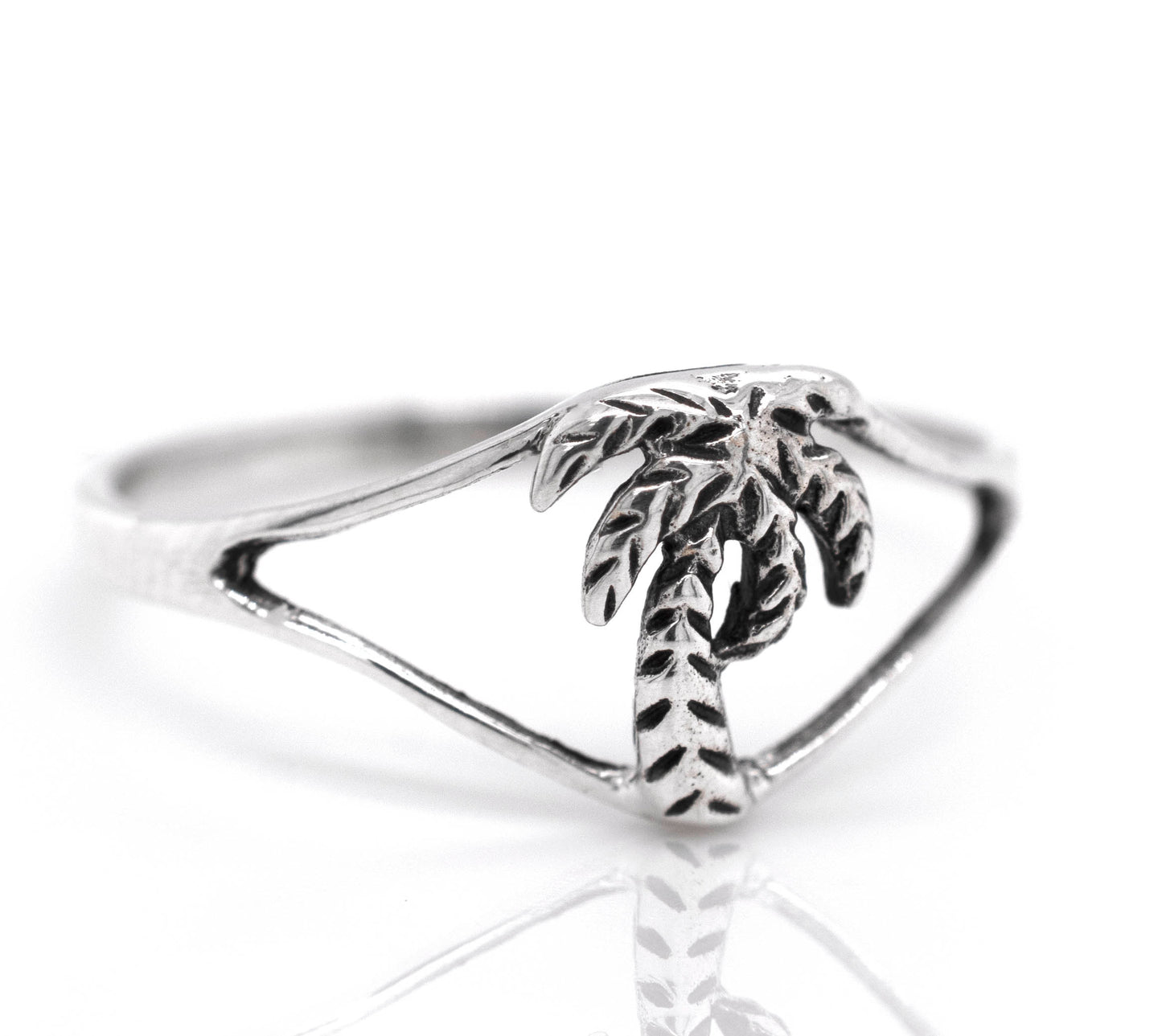 
                  
                    A sterling silver Delicate Palm Tree Ring with a palm tree engraving.
                  
                