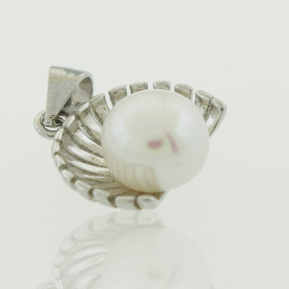 A petite Super Silver Pearl Pendant showcasing a fresh water pearl on a white background.