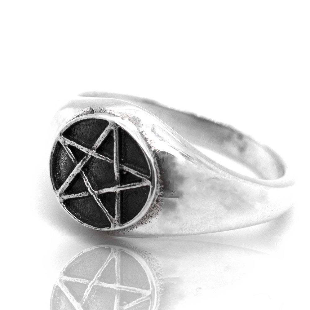 A gothic signet ring featuring a Pentagram Ring in silver.