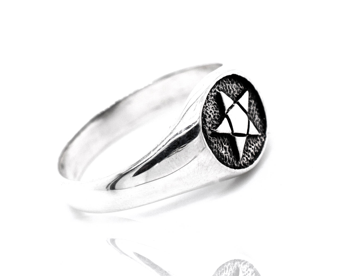 A silver signet ring with a star, perfect for those with a gothic style or a fascination with the Pentagram Ring.