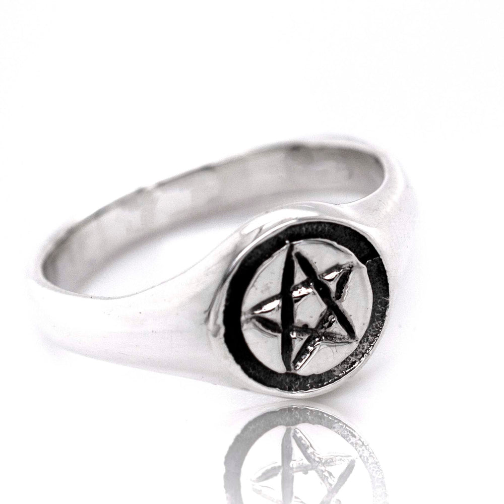 A gothic sterling silver Pentagram Ring with a pentagram star design.