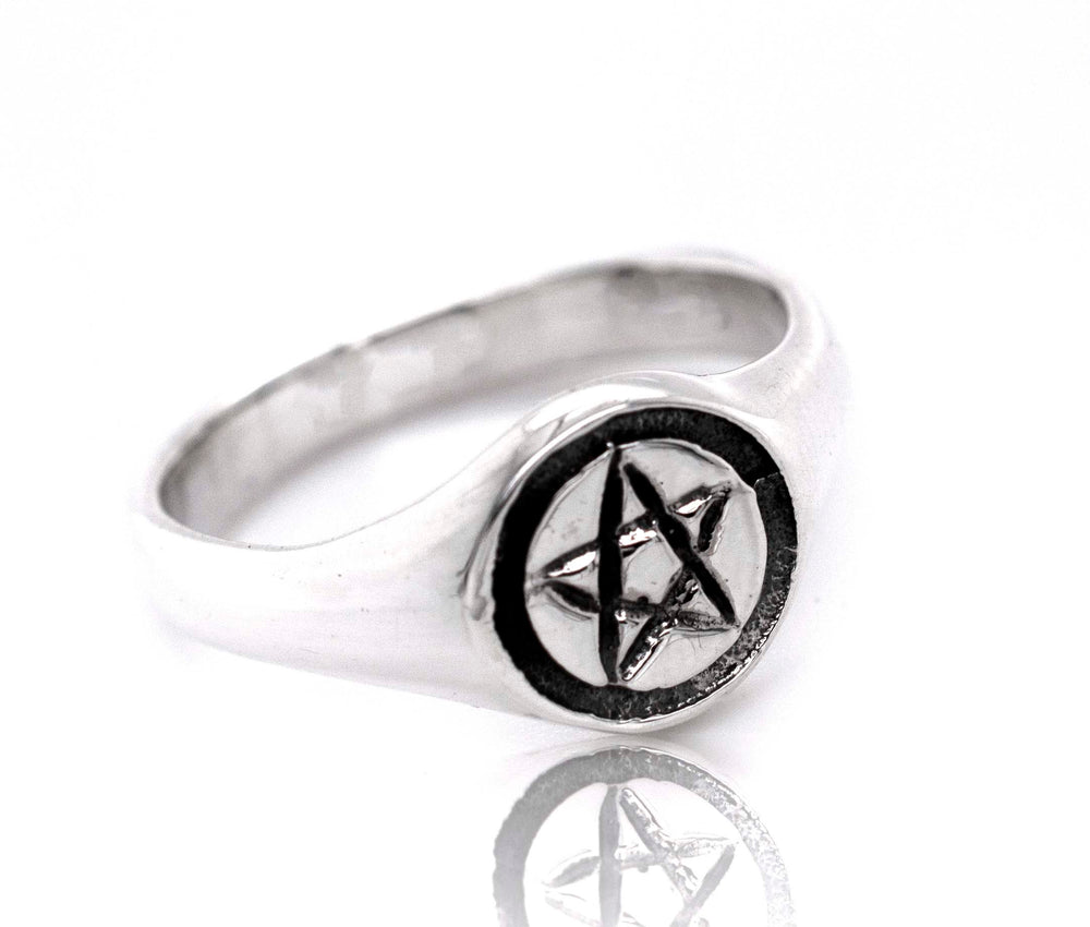 A gothic sterling silver Pentagram Ring with a pentagram star design.