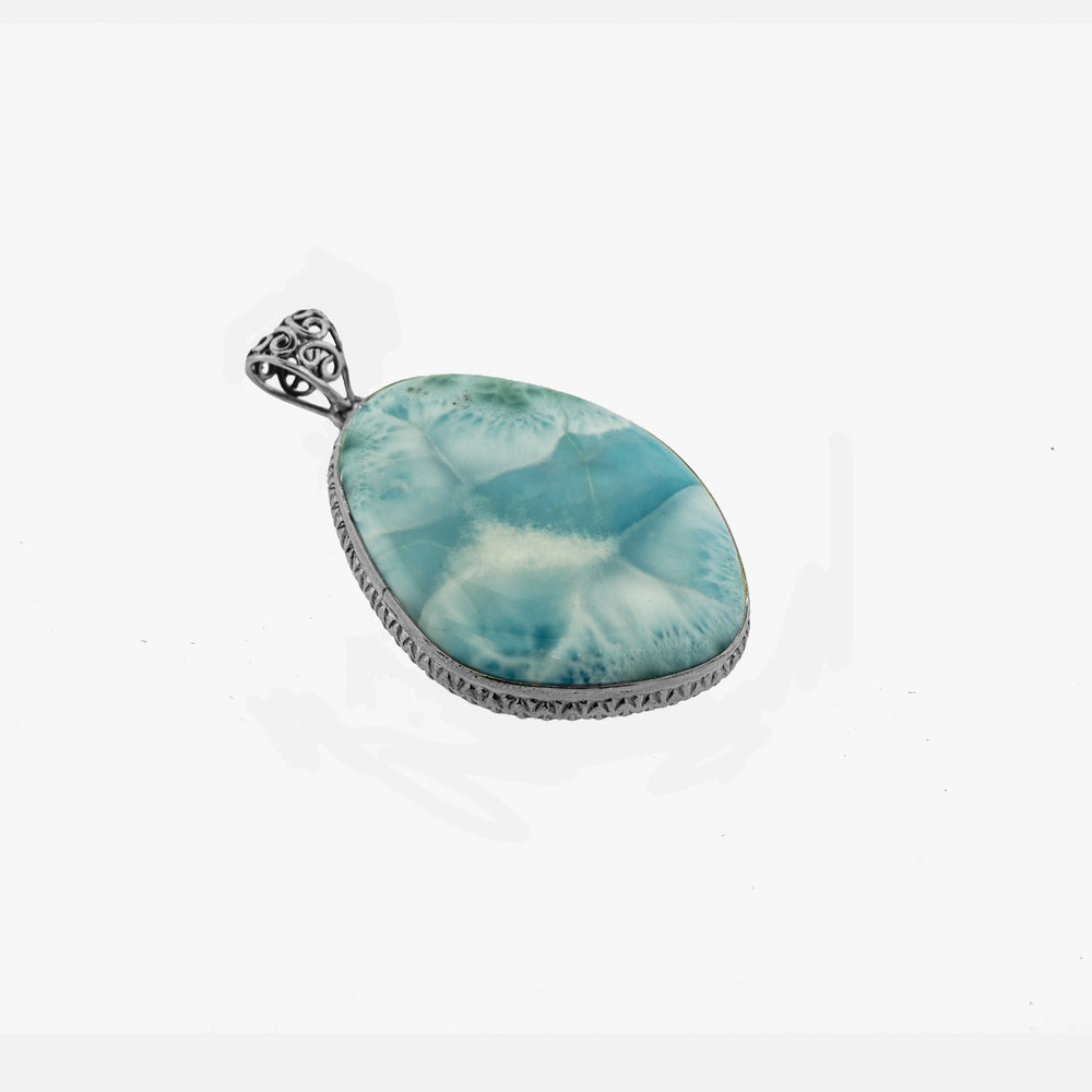 A Larger Larimar Pendant adorned with a blue stone and diamonds by Super Silver.