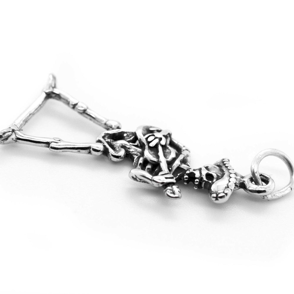 A Super Silver Mariachi Skeleton with Guitar Charm, perfect for fans of Day of the Dead or Día De Los Muertos.
