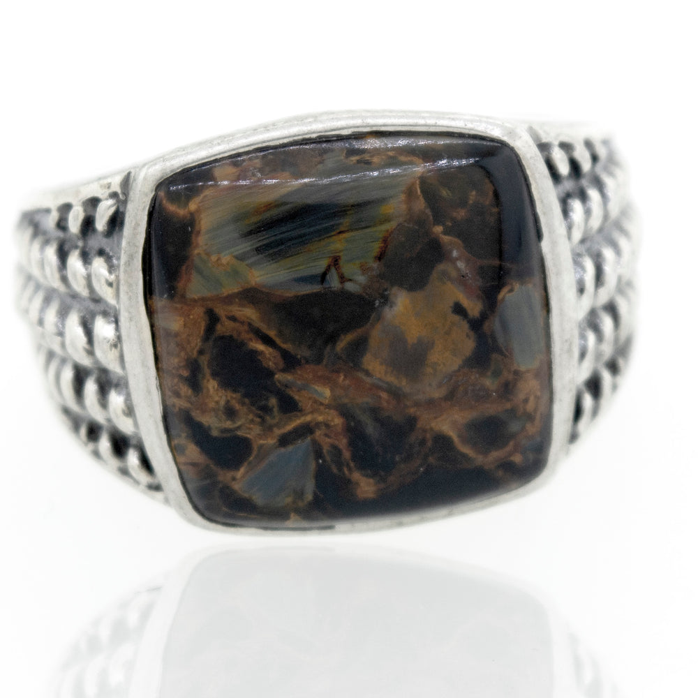 
                  
                    A statement Pietersite Signet Ring With Rope Design with a black and brown stone.
                  
                
