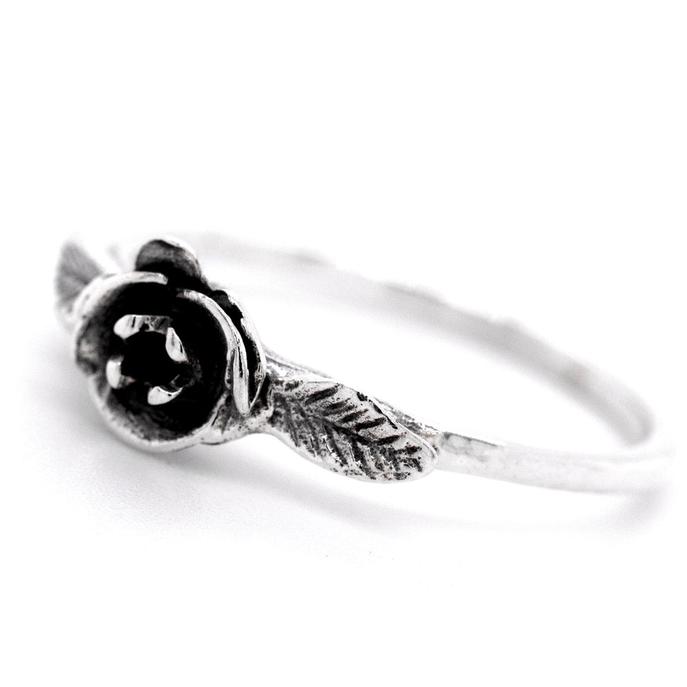 
                  
                    A fashionabe rose ring adorned with a black rose, embracing the floral essence.
                  
                