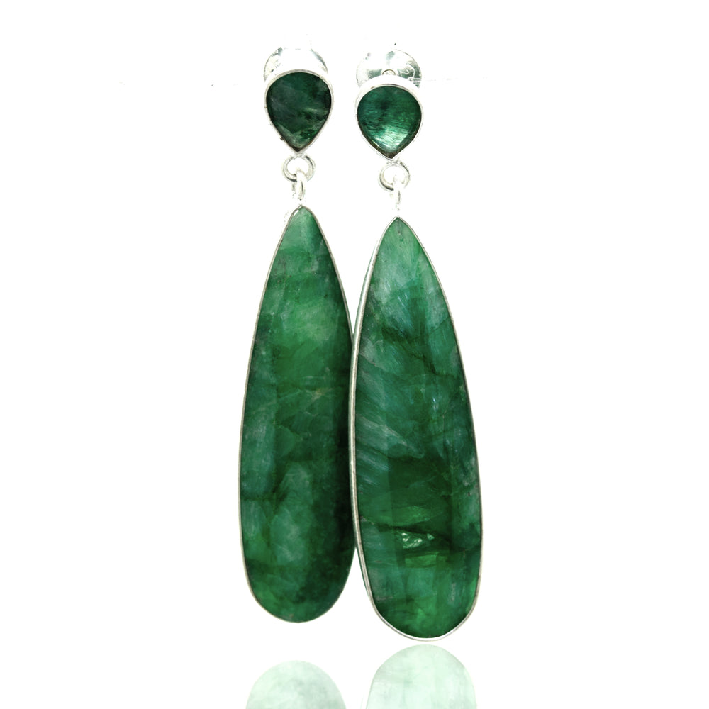 
                  
                    Super Silver's Vibrant Teardrop Shape Emerald Earrings.
                  
                