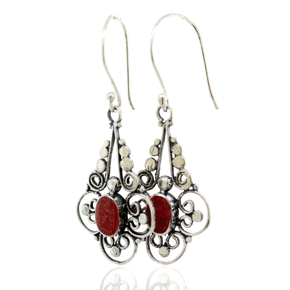 A pair of Oval Coral Dangle Earrings with a Flower design from the brand Super Silver.