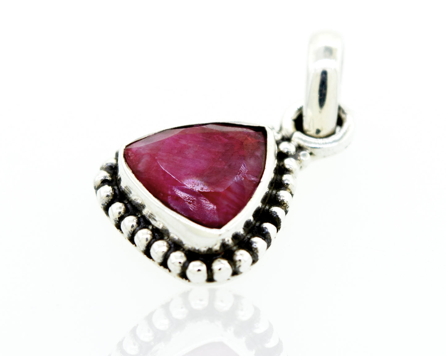 A Super Silver beautiful triangular shape ruby pendant with beads design in a silver setting.