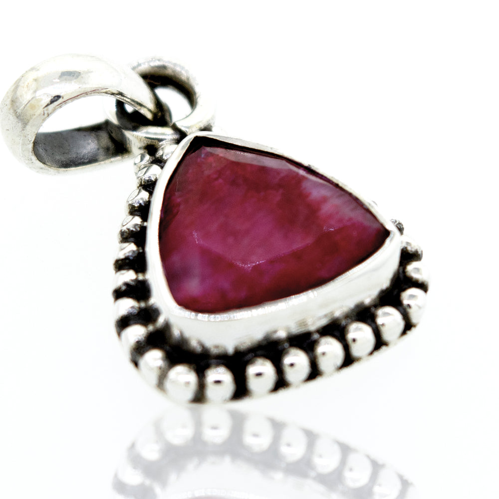 A Beautiful Triangular Shape Ruby Pendant With Beads Design by Super Silver.