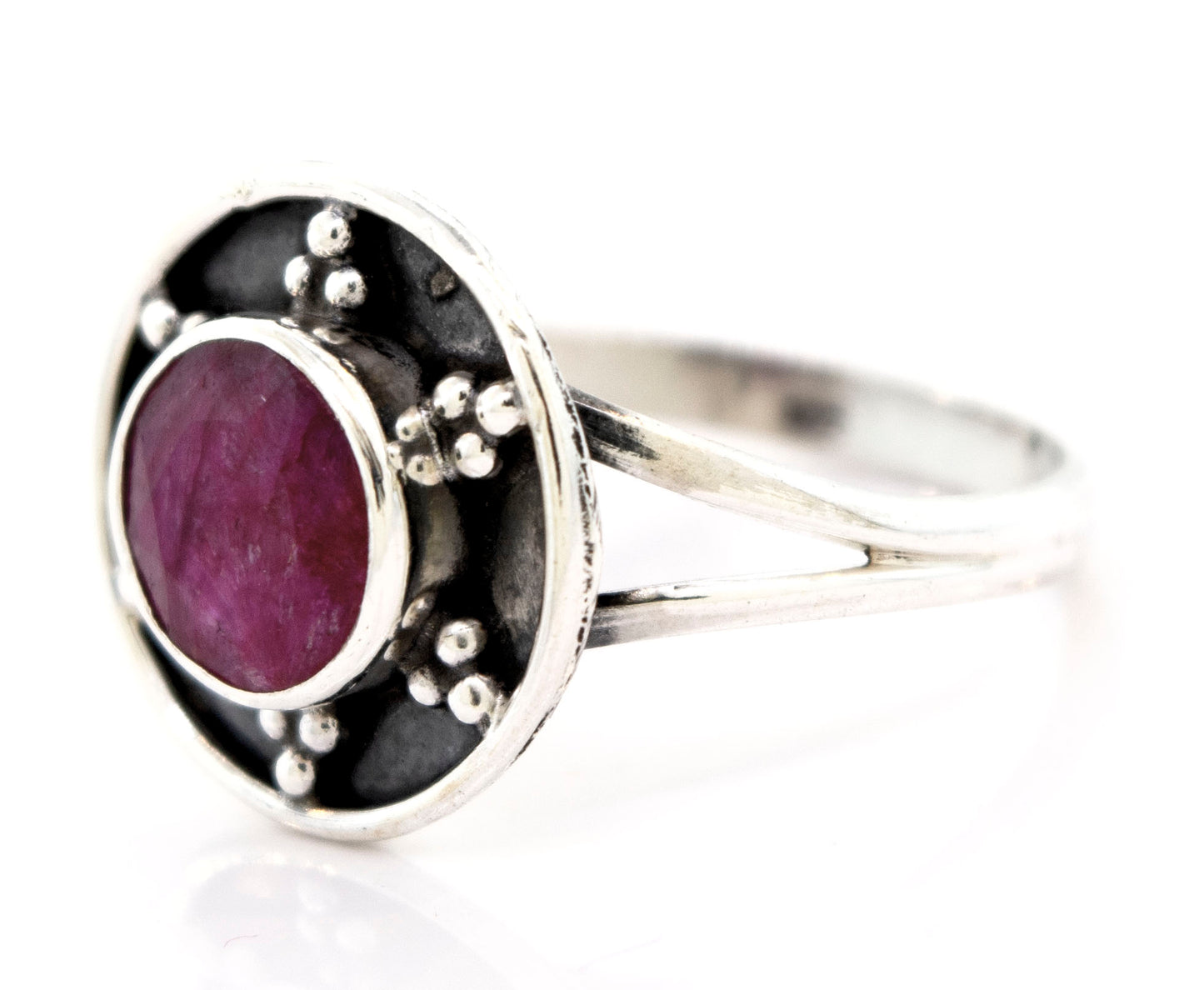 
                  
                    A Super Silver Ruby Ring With Unique Oxidized Silver Design with a ruby stone in the center.
                  
                