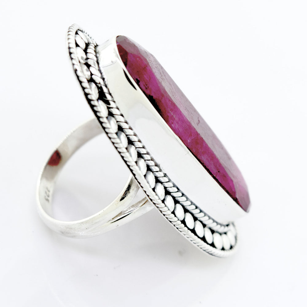 
                  
                    An Elegant Raw Ruby Ring with a ruby stone in the center, set in a Super Silver setting.
                  
                