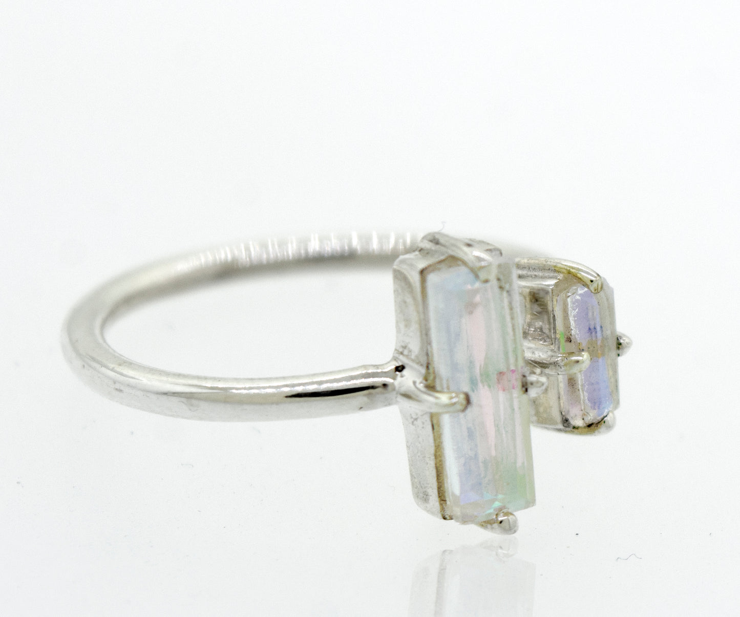 
                  
                    A rectangular-shaped Super Silver sterling silver ring adorned with two opal stones.
                  
                