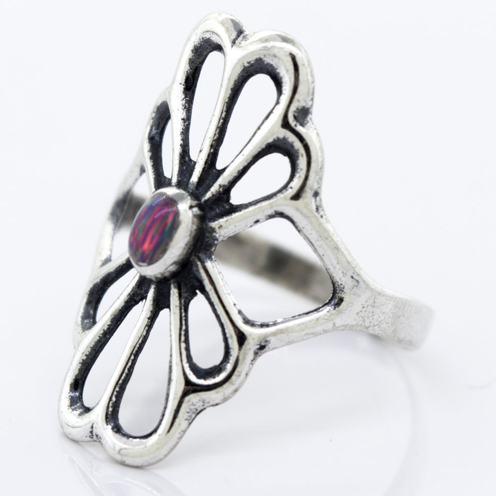 
                  
                    A handcrafted Super Silver American Made Flower Ring with an oval opal stone.
                  
                