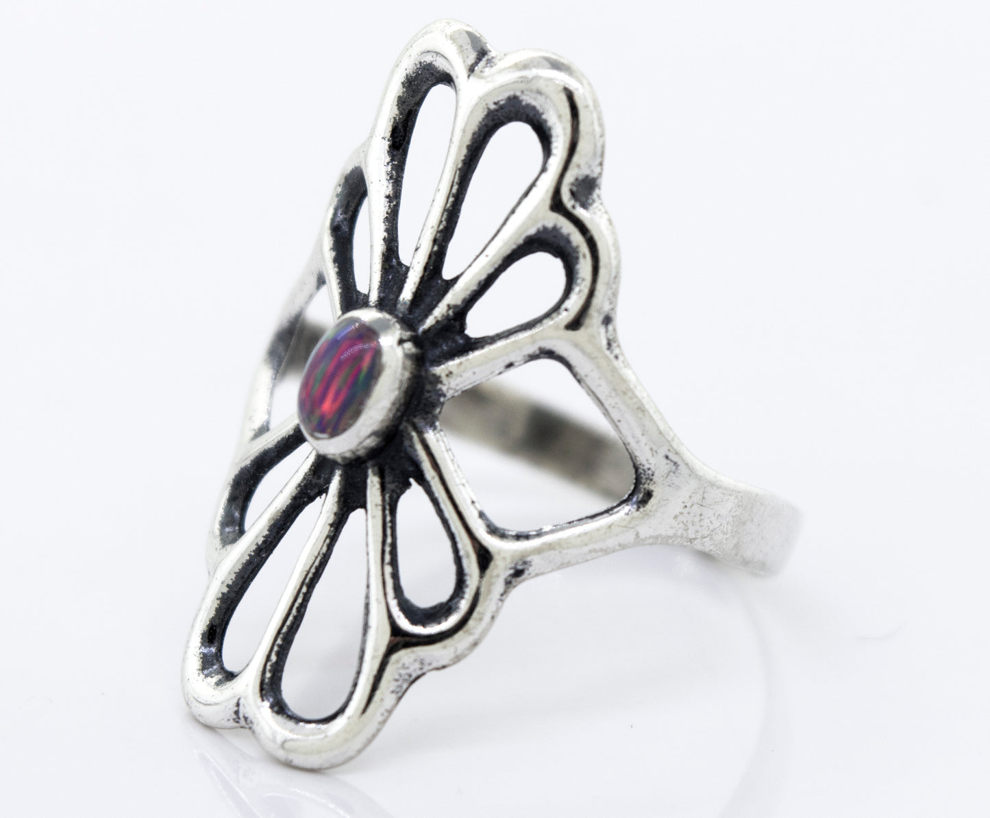 
                  
                    A handcrafted Super Silver American Made Flower Ring with an oval opal stone.
                  
                