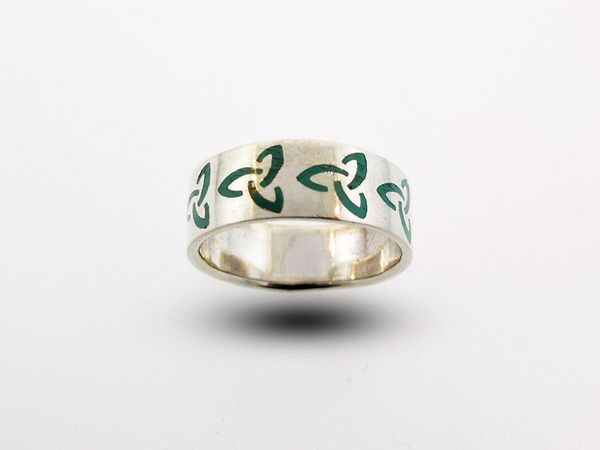 A Super Silver Celtic Trinity Knot Thick Band Ring with green leaves.