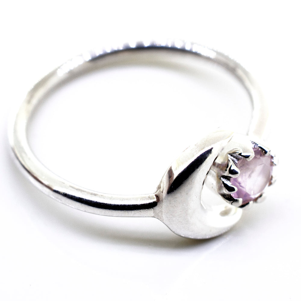 A Super Silver Online Only Exclusive Rose Quartz Ring with a pink stone on it.