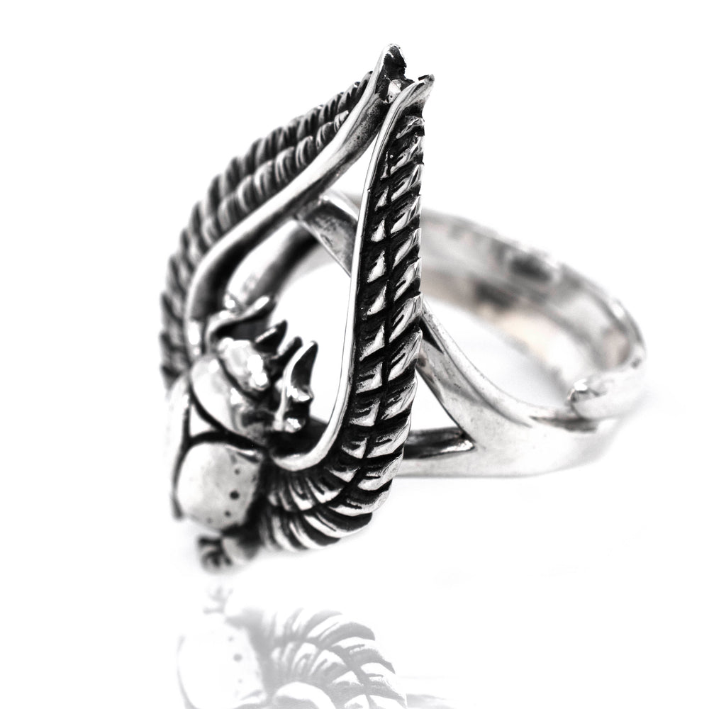 
                  
                    A bold Winged Scarab Ring with an eagle on it.
                  
                