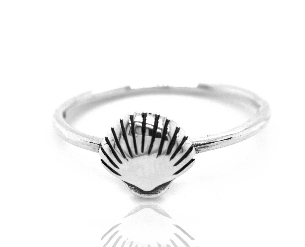 A Delicate Seashell Ring, perfect for ocean lovers browsing through storefronts, from the brand Super Silver.