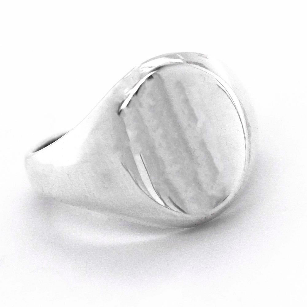 
                  
                    An everyday wear Super Silver Oval Signet Ring with an engraved design on a white background.
                  
                