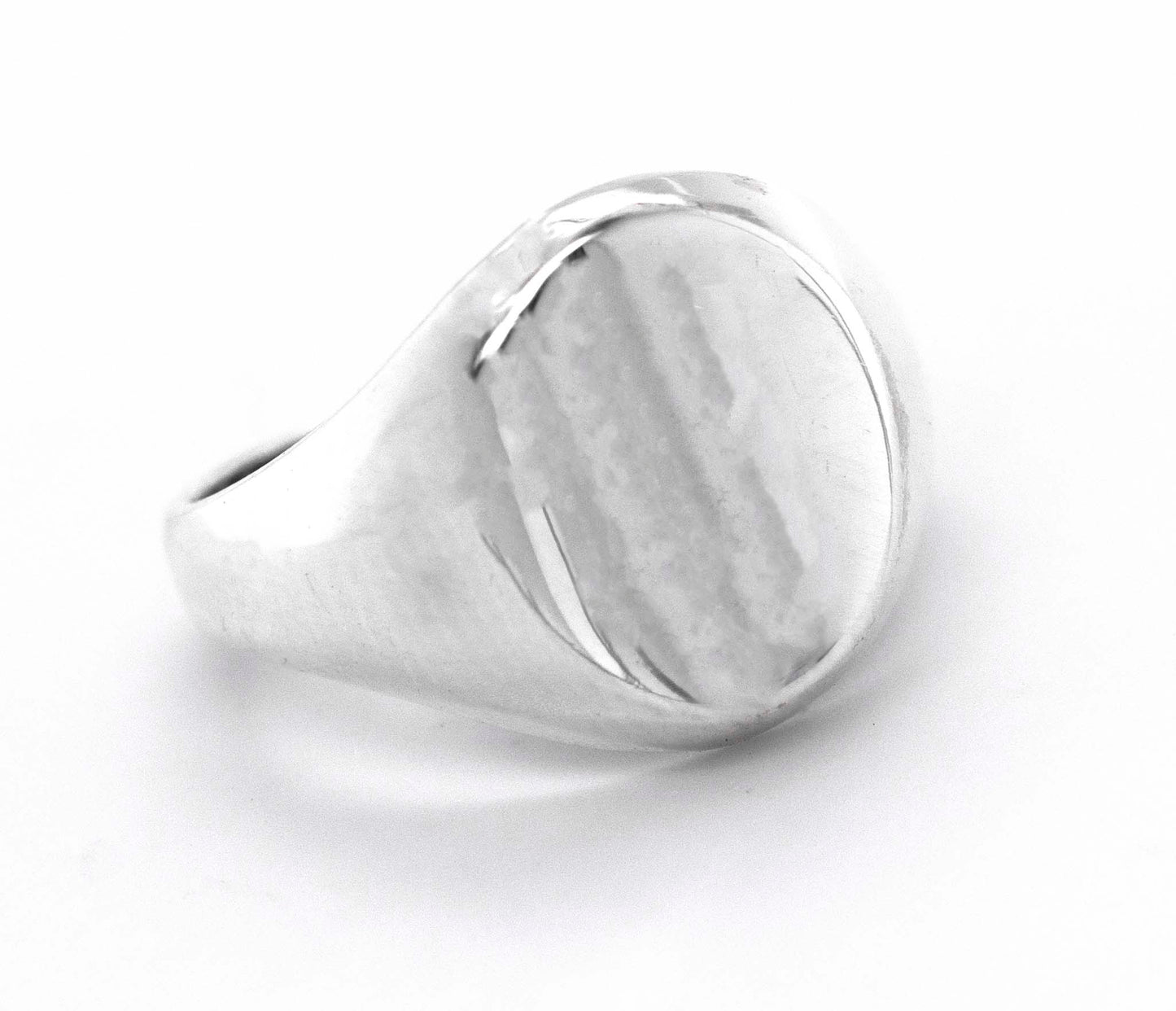 
                  
                    An everyday wear Super Silver Oval Signet Ring with an engraved design on a white background.
                  
                