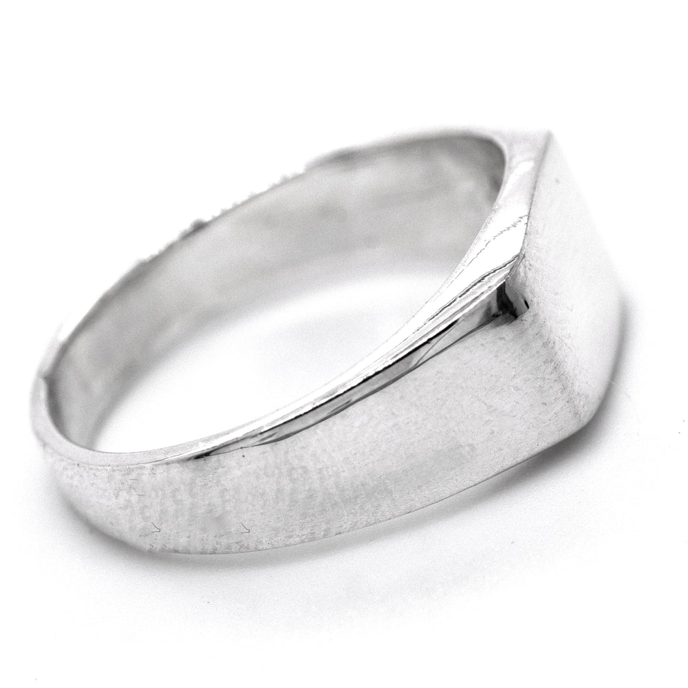 
                  
                    A rectangular signet ring on a white background.
                  
                