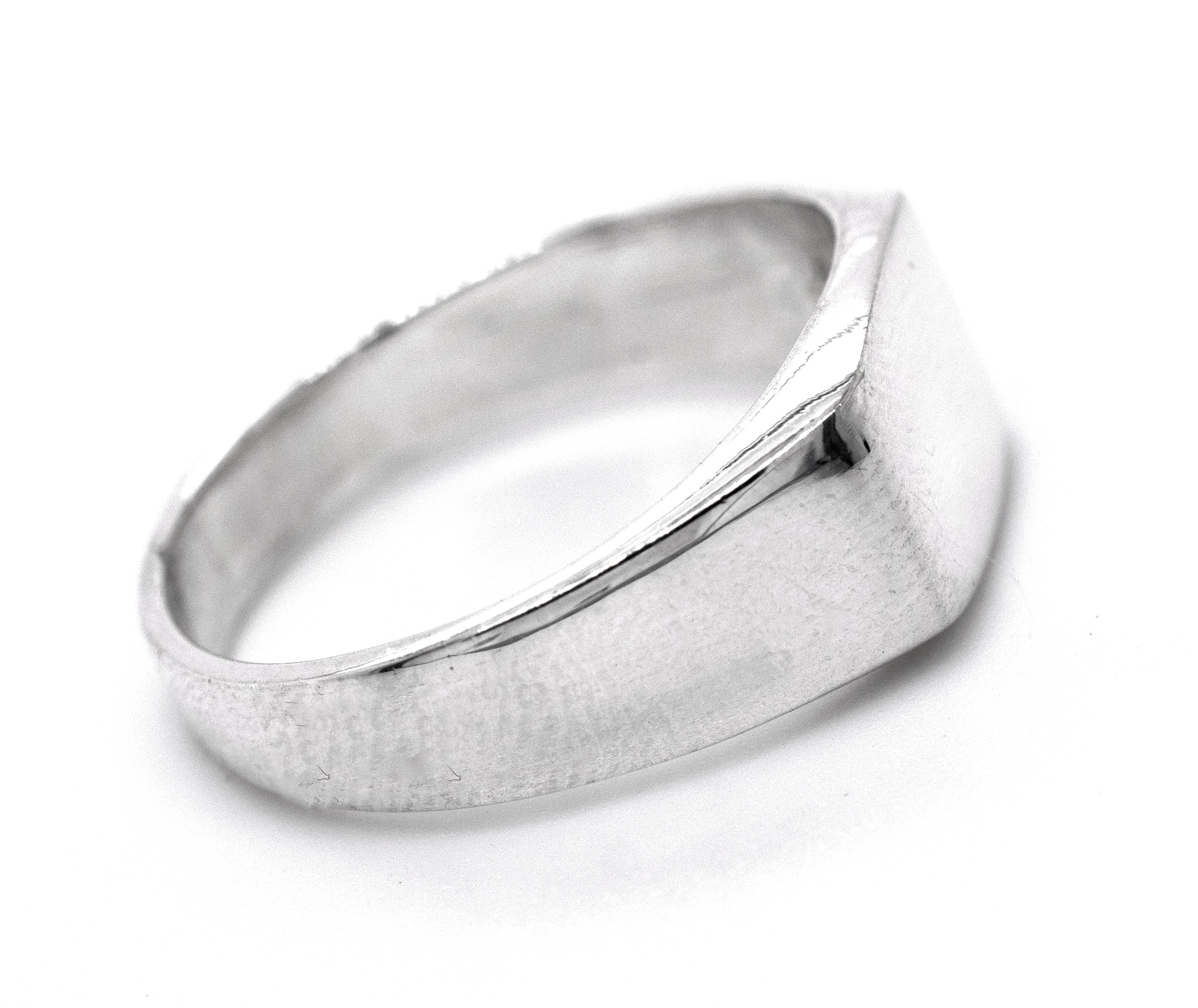 A rectangular signet ring on a white background.