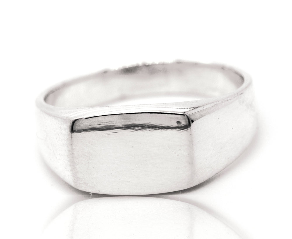 A rectangular signet ring on a white background.