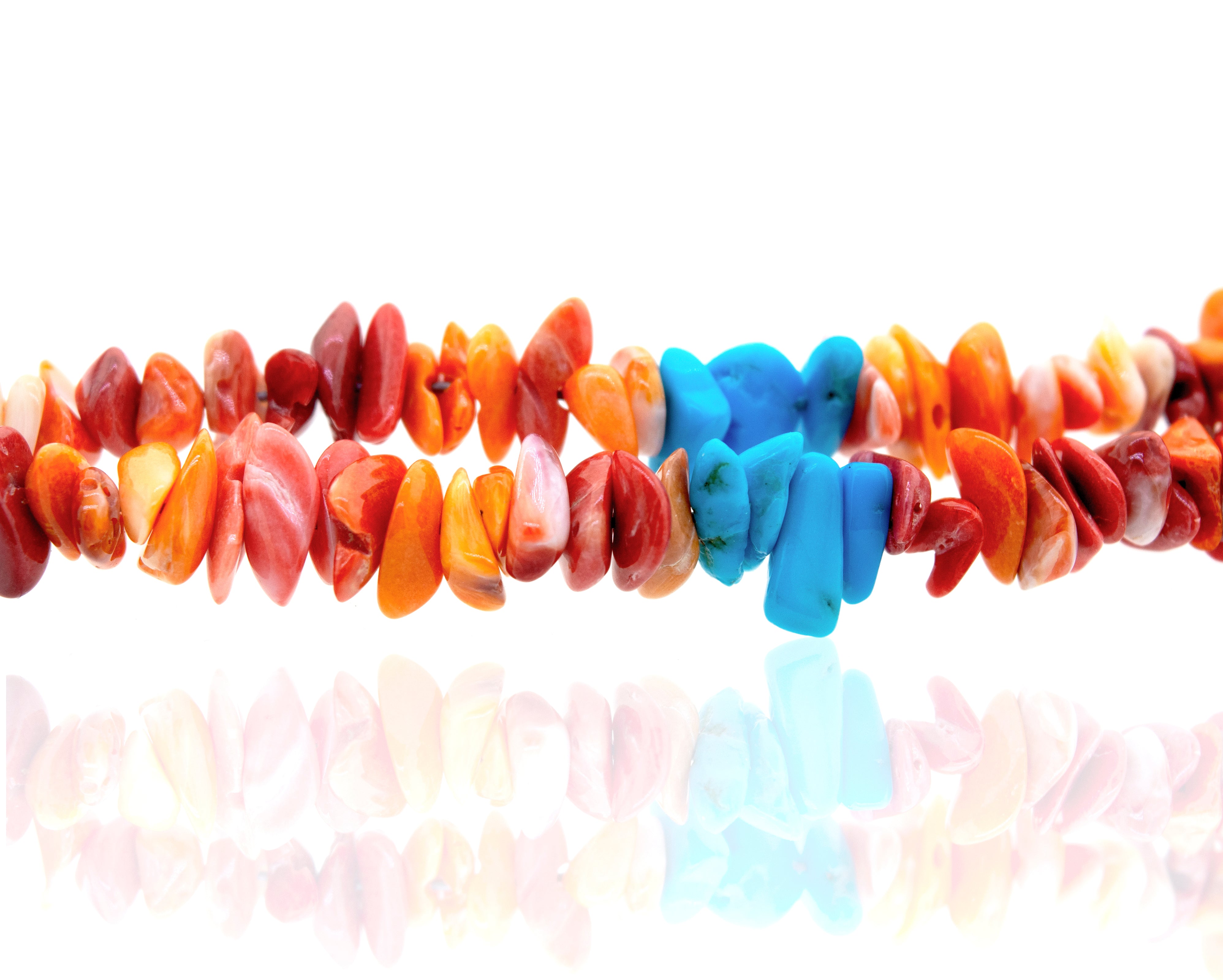 A vibrant Handmade Spiny Oyster Shell and Turquoise Necklace made by Super Silver, and consisting of spiny oyster shell and turquoise beads.