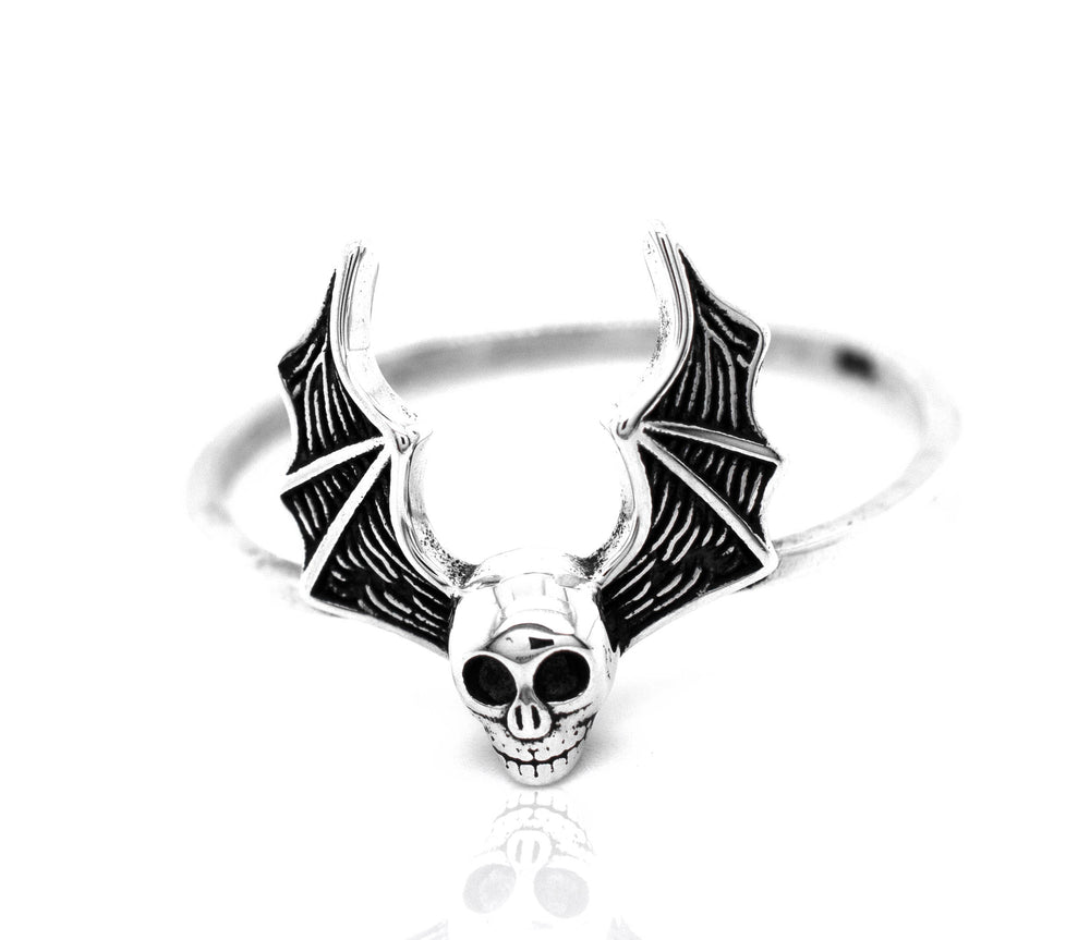 A gothic silver Skull Bat Ring with bat wings.