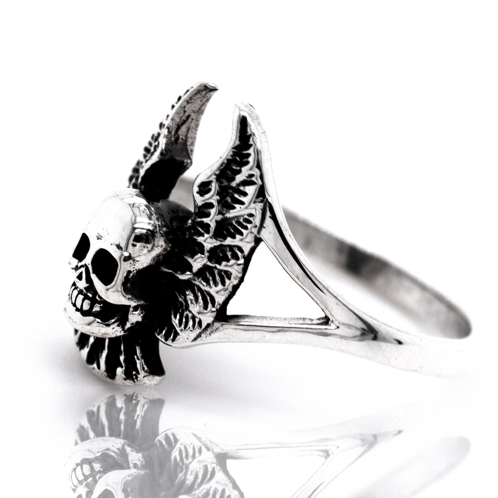 A Sterling Silver Skull Ring With Wings.