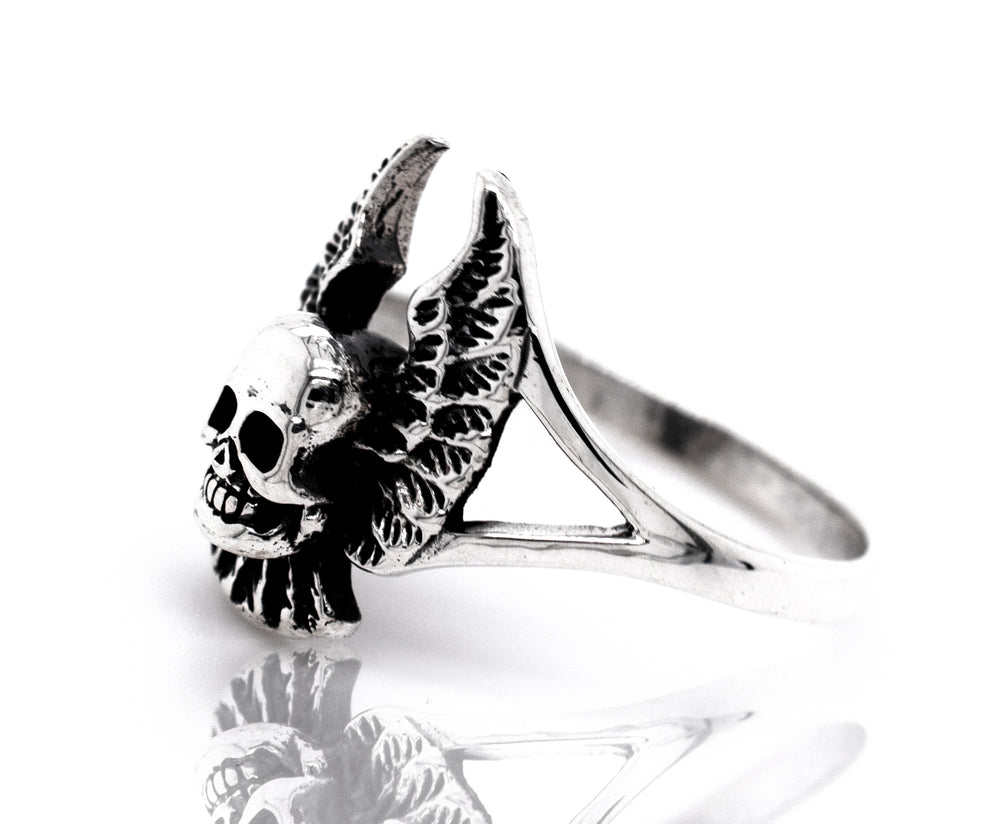 A Sterling Silver Skull Ring With Wings.