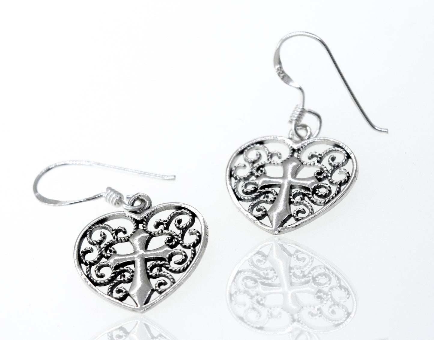 
                  
                    A pair of open Filigree Heart with Cross Sterling Silver Earrings by Super Silver.
                  
                