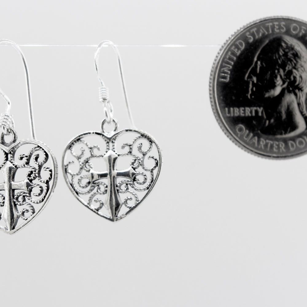 
                  
                    A pair of open Filigree Heart with Cross Earring, Super Silver sterling silver earrings.
                  
                