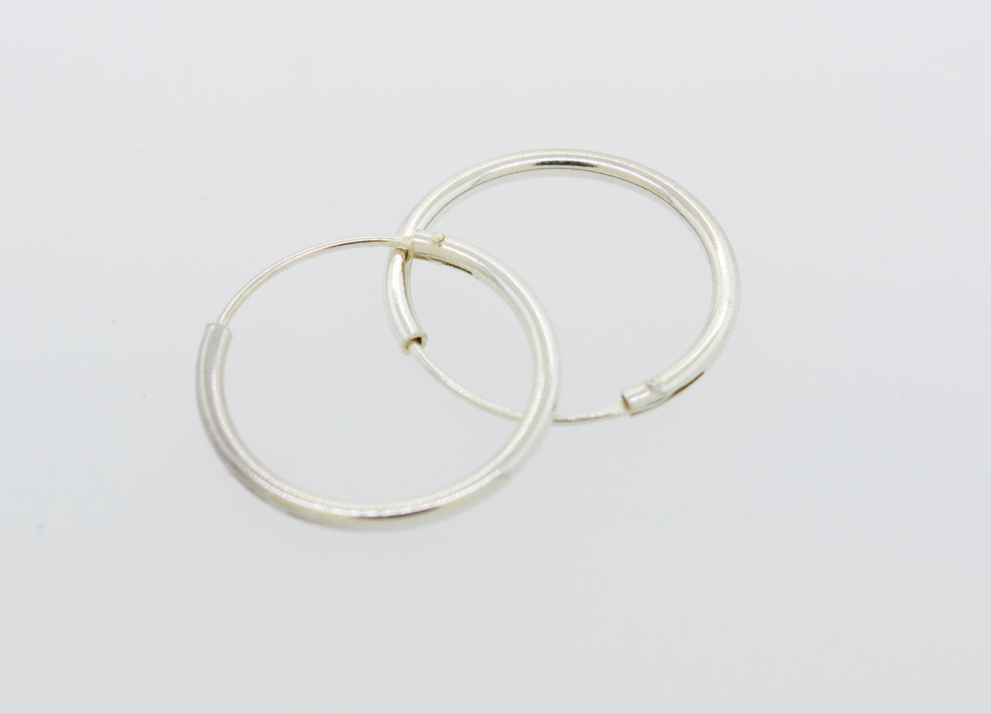 Everyday use Super Silver Silver Infinity Hoops 1mm X 17.5mm on a white surface.