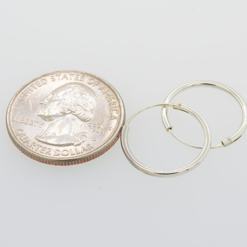 A pair of Super Silver Silver Infinity Hoops 1mm X 17.5mm, perfect for everyday use.