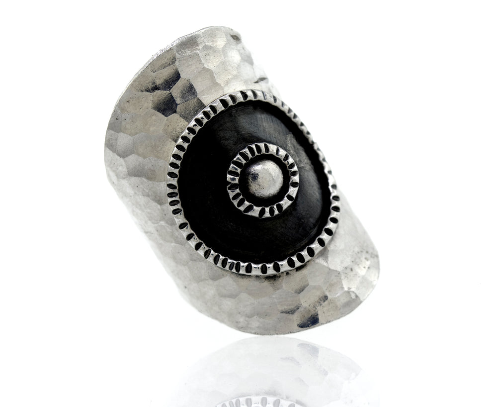 An adjustable Super Silver ring with a hammered sterling silver band and a mesmerizing oxidized bull's eye design adorned with contrasting black and white stones - the Sterling Silver Bull's Eye Adjustable Ring.