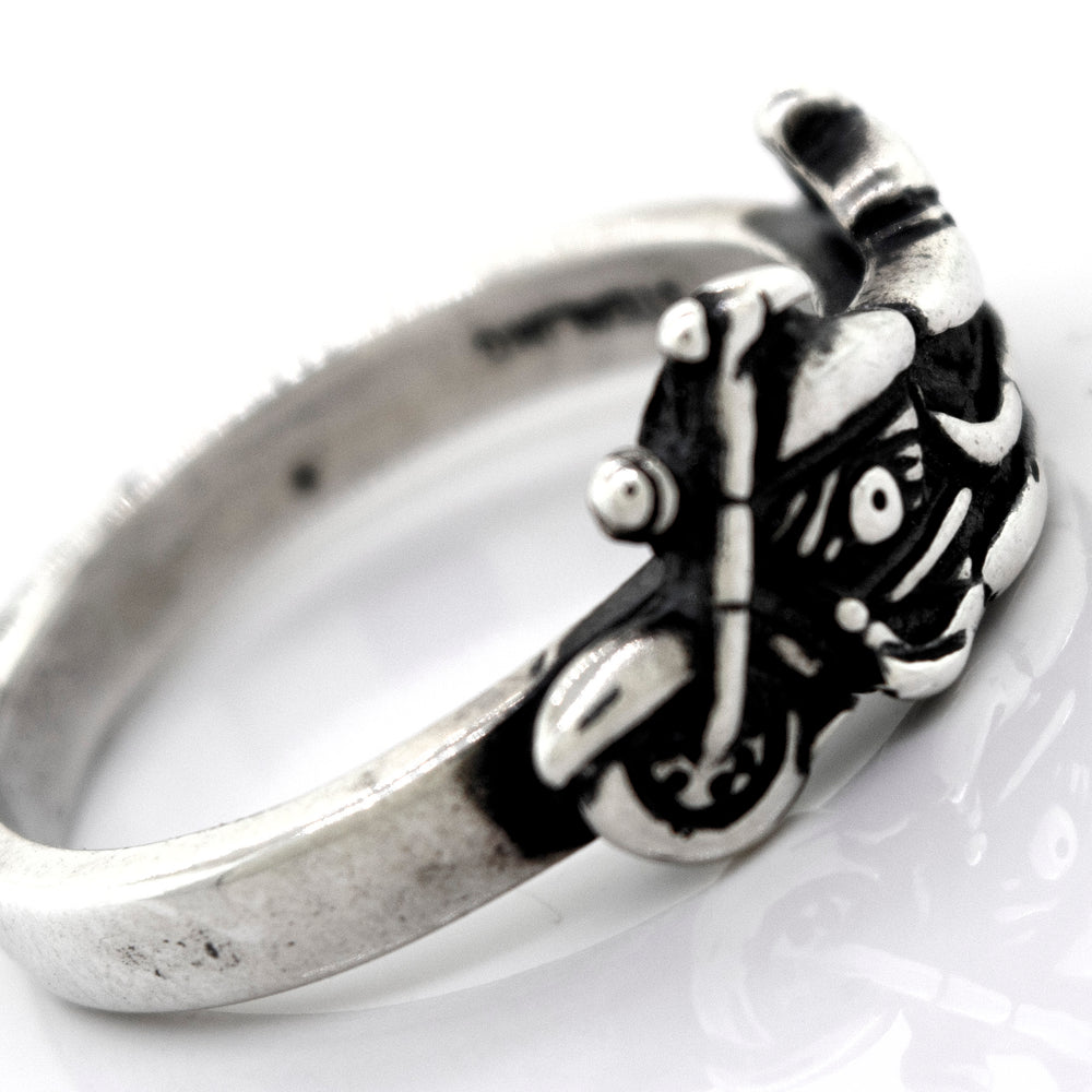 
                  
                    A handcrafted Super Silver American Made Motorcycle Ring featuring a skull and crossbones.
                  
                