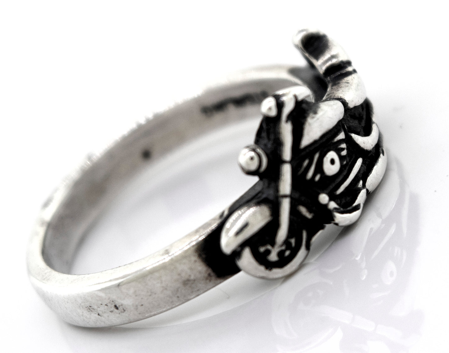 
                  
                    A handcrafted Super Silver American Made Motorcycle Ring featuring a skull and crossbones.
                  
                