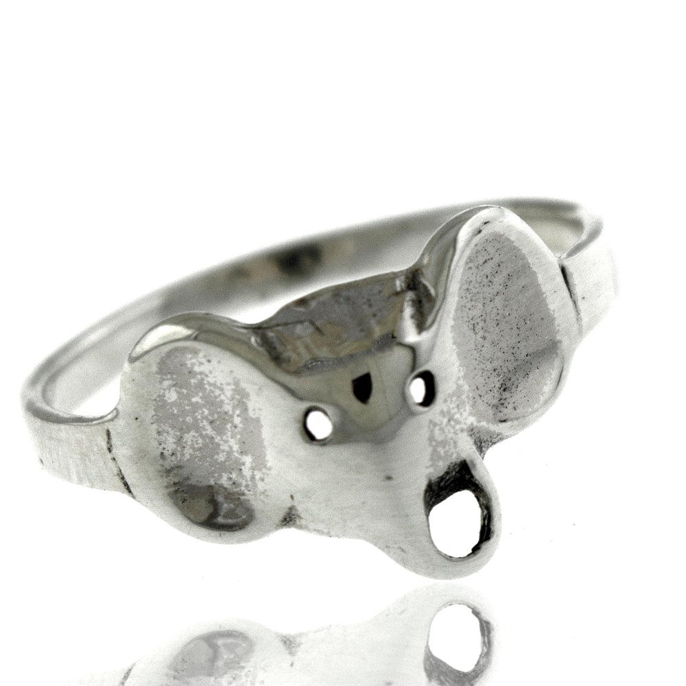
                  
                    An elegant midi ring, the Simple Elephant Head Ring from Super Silver, features a simple design with an elephant head.
                  
                