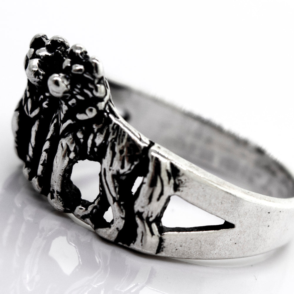 A handcrafted American Made Wolf Ring with two lions on it. (Brand Name: Super Silver)