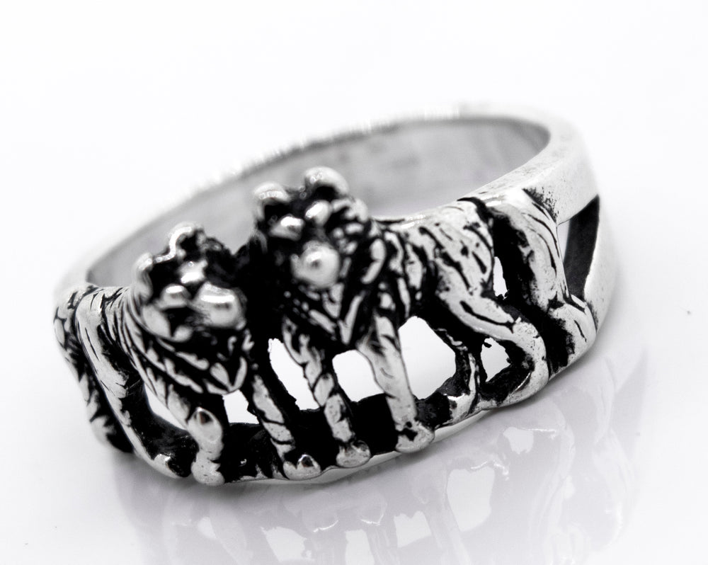 
                  
                    The Super Silver American Made Wolf Ring features three wolves elegantly engraved on it.
                  
                