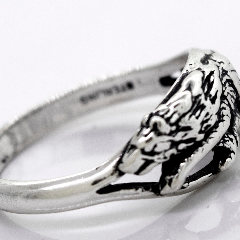 
                  
                    An American Made Prowling Wolf Ring with a prowling wolf design made of oxidized sterling silver by Super Silver.
                  
                