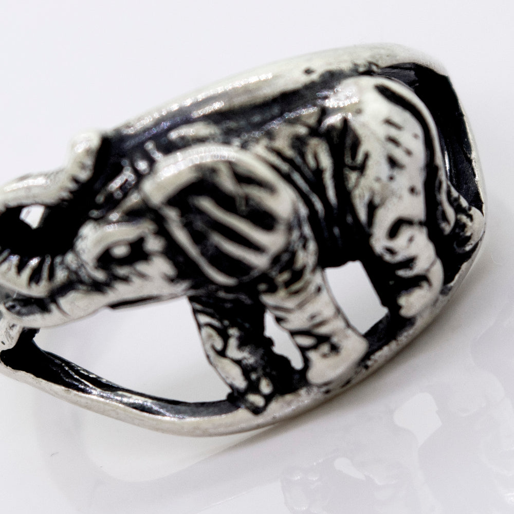 
                  
                    An American Made Elephant Ring on a white surface.
                  
                