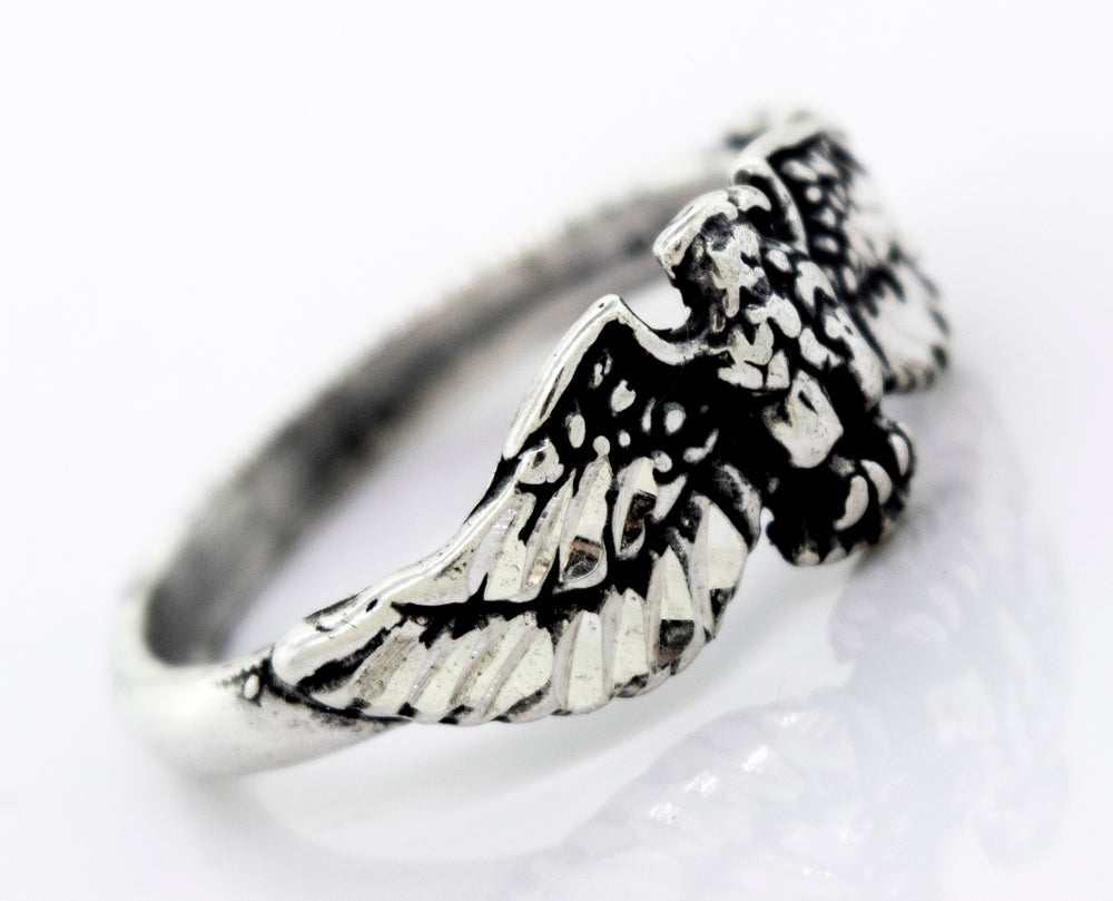 A Super Silver American Made Eagle Ring with an eagle design.