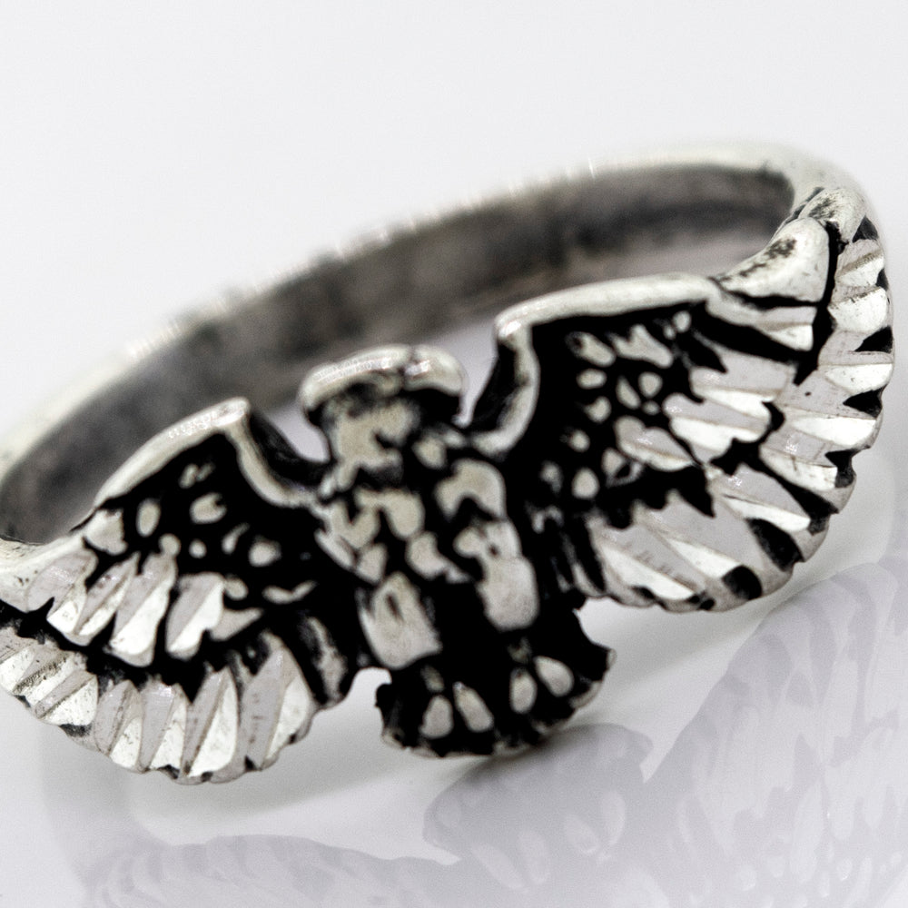 A handcrafted Super Silver American Made Eagle Ring with an eagle design.