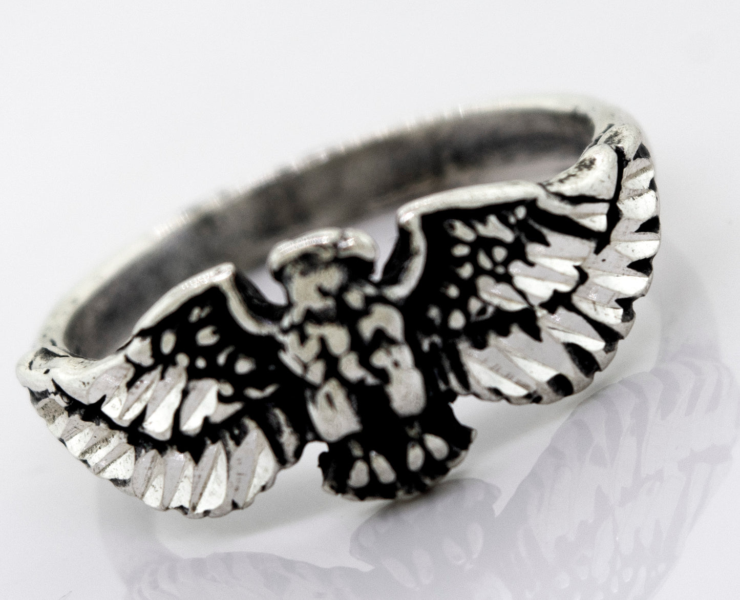 A handcrafted Super Silver American Made Eagle Ring with an eagle design.