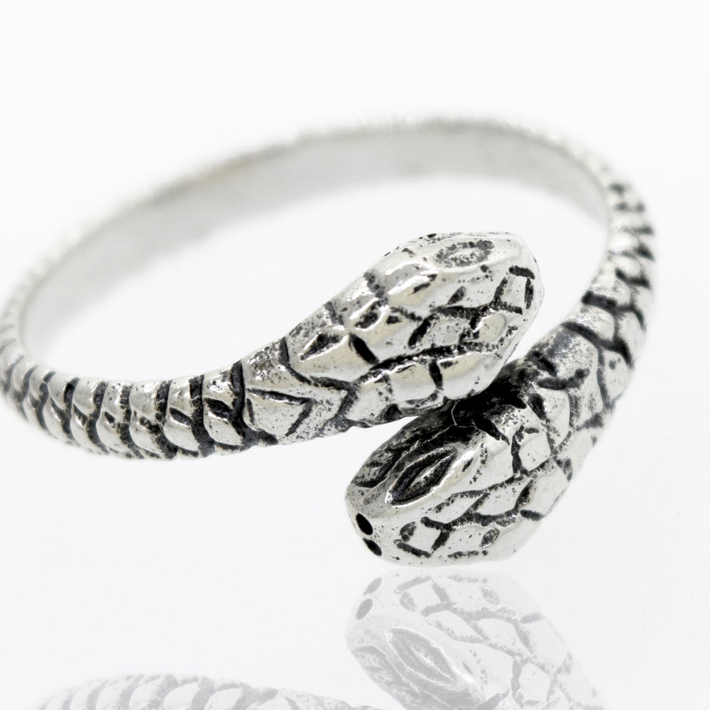 
                  
                    An adjustable Super Silver Sterling Silver Two Headed Snake Ring on a white surface.
                  
                