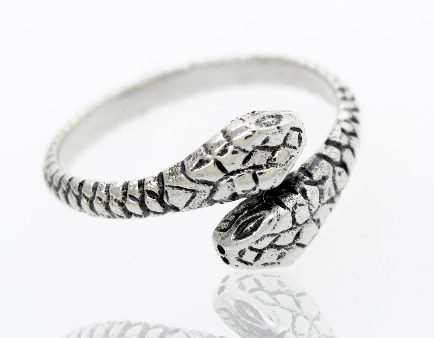 
                  
                    An adjustable Super Silver Sterling Silver Two Headed Snake Ring on a white surface.
                  
                