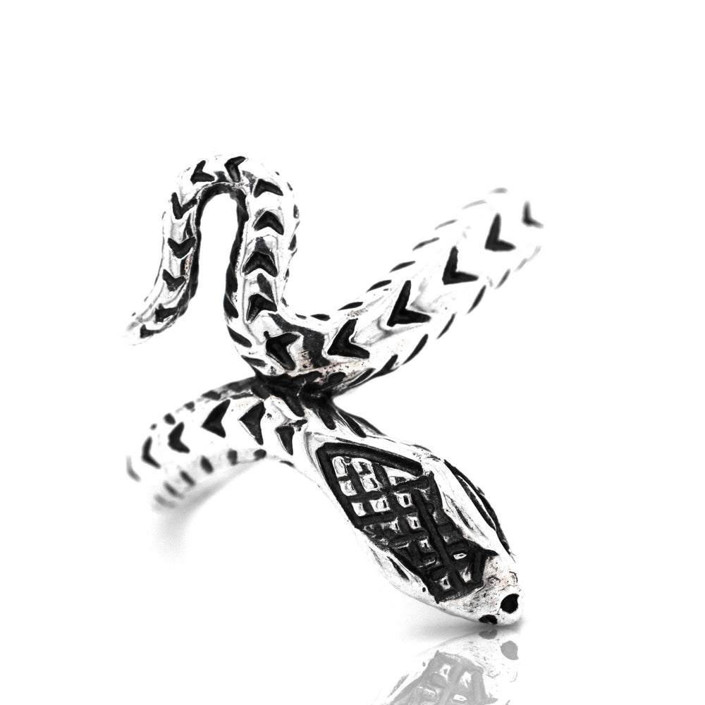 
                  
                    A captivating Super Silver snake ring with a diamond pattern on a white surface.
                  
                